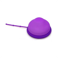 Reusable menstrual disc in purple with long removal stem