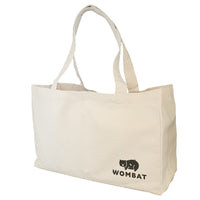 Off-white reusable canvas shopping bag with handles and Wombat logo