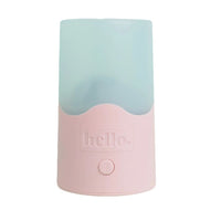 Pink steam steriliser base with translucent light blue lid and embossed Hello logo