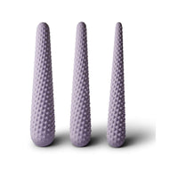 Purple silicone dilator set, three textured cylinders standing upright