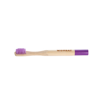 Kids bamboo toothbrush with purple bristles and purple handle tip
