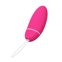 Pink pelvic trainer with cord and small loop connector at the base
