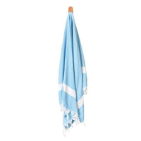 Turkish towel sarong with light blue base and white stripe, tassel fringe hem.