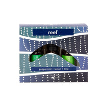 Reef essential oil trio box with three bottle labels: peppermint, lemon, and lime